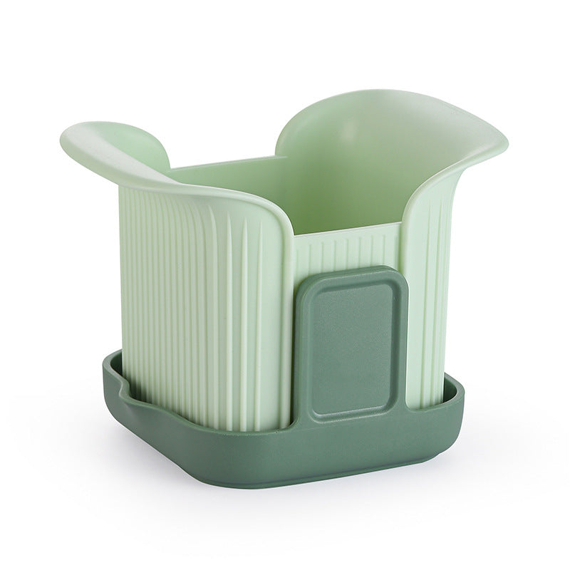 Green plastic cup holder with a lid on a white background