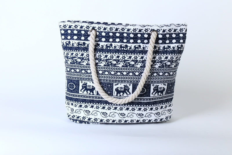 Blue and white printed canvas tote bag with rope handles and open top