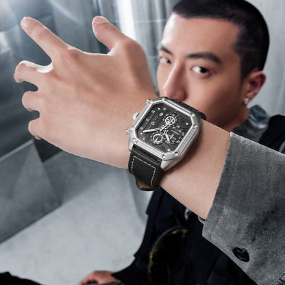 Man wearing a stylish watch with a blurred background