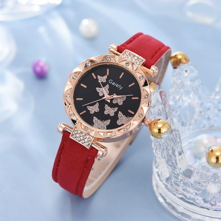 Women’s butterfly quartz watch with black dial and red leather strap