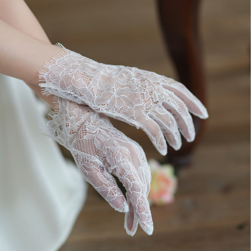 White lace tulle bridal gloves with floral lace, long cuff, and scalloped finger edges