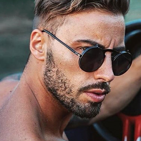 Man wearing sunglasses with a blurred background