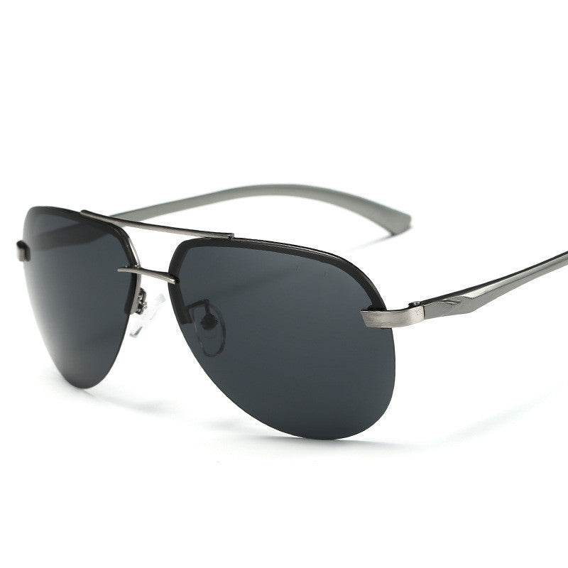 Sunglasses with dark lenses and silver frame on a white background