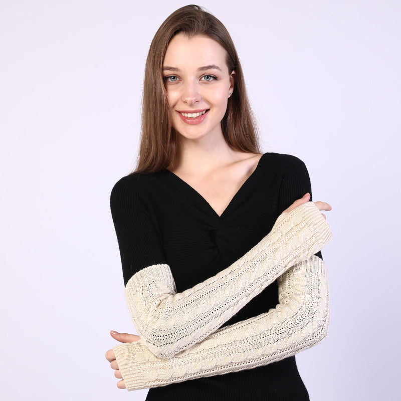 Twist-knit fingerless arm warmers in cream beige, long sleeves with openwork cable pattern