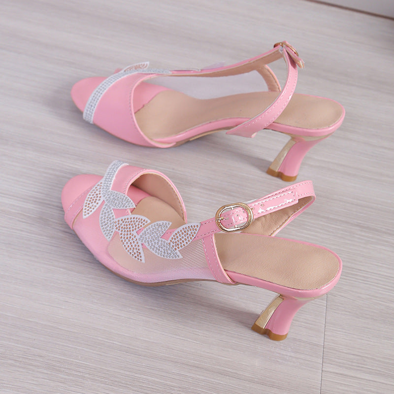 Pink heeled sandals with rhinestone straps and round buckle ankle strap
