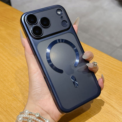 Hand holding a phone with a blue case on a wooden surface