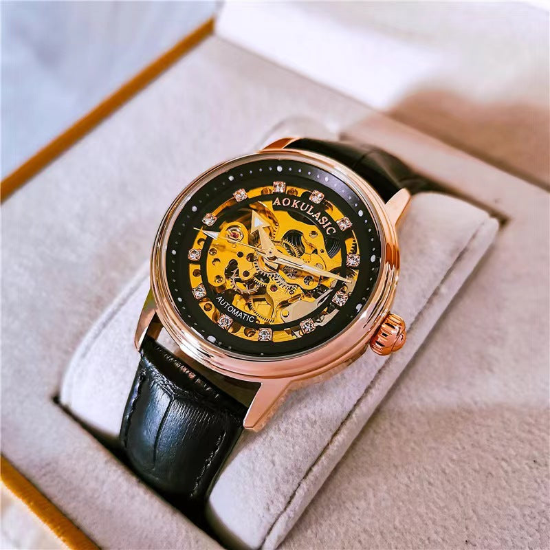 Black leather mechanical watch with rose-gold case and diamond-accent bezel