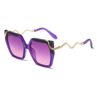 Purple sunglasses with gold chain detail on a white background