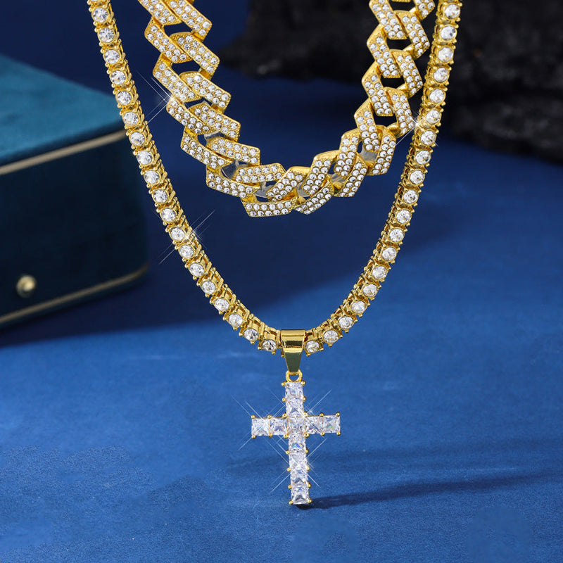 Gold chain necklace with a cross pendant on a blue background