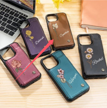 Maroon and purple floral phone cases with camera cutouts and small metal button accents.
