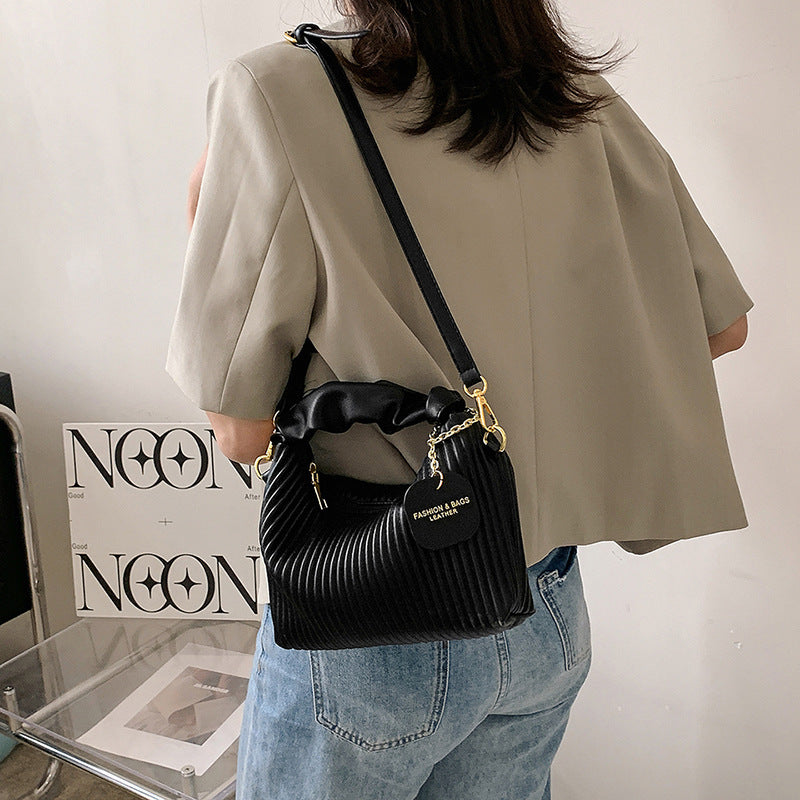 Black ribbed PU leather small crossbody bag with chain strap and heart charm tag