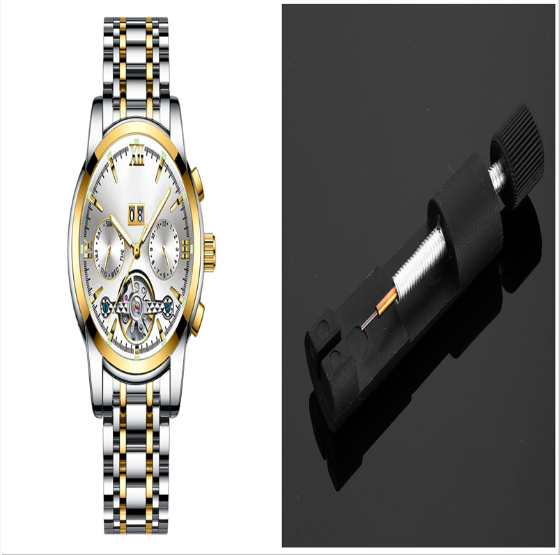 Luxury watch with a gold and silver band and a black tool on a white background