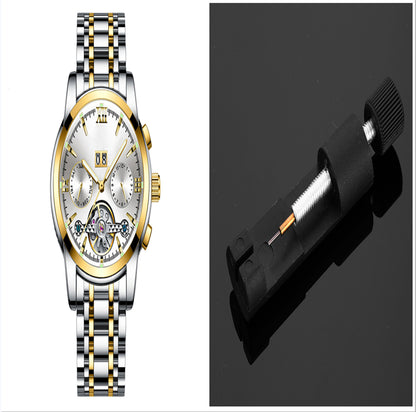 Luxury watch with a gold and silver band and a black tool on a white background
