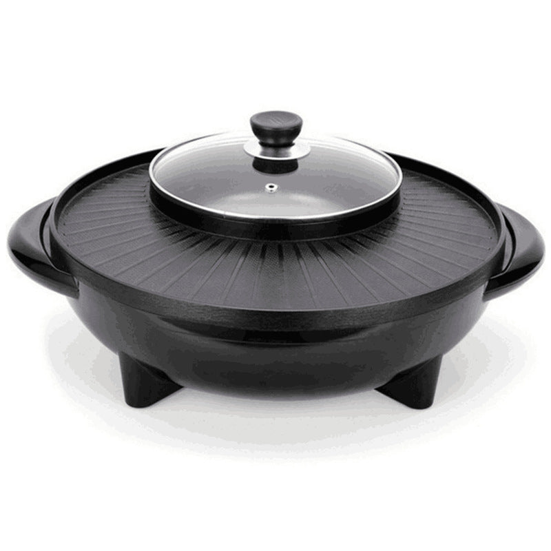 Black electric skillet with glass lid on a white background