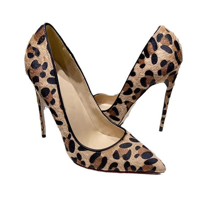 Leopard print high-heeled shoes on a white background