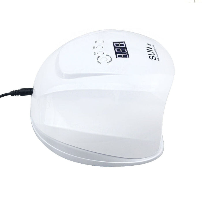White nail dryer with digital display on a white background