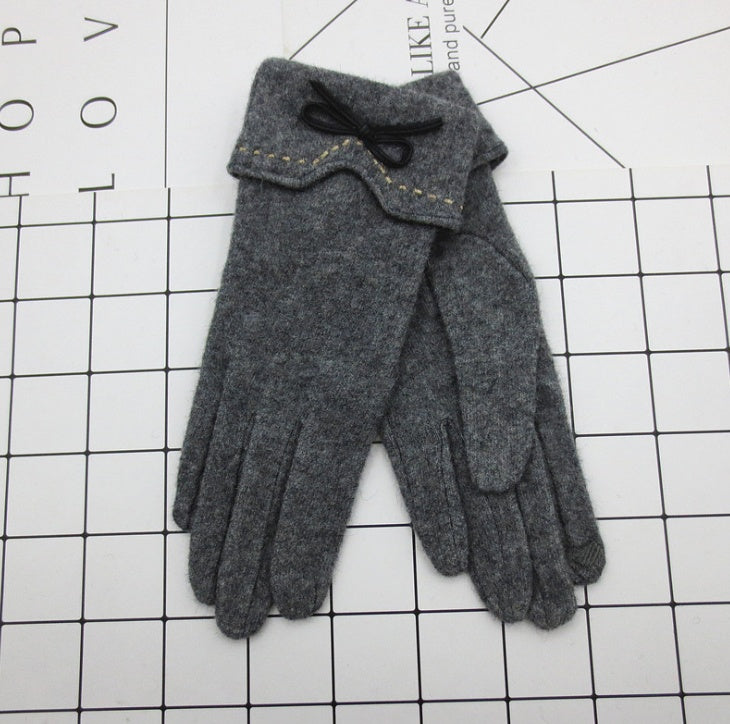 Pair of gray gloves on a white grid background