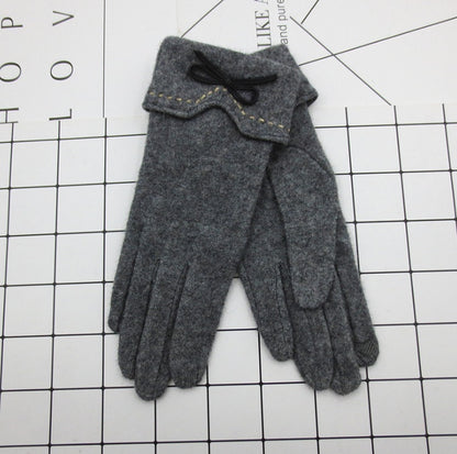 Pair of gray gloves on a white grid background