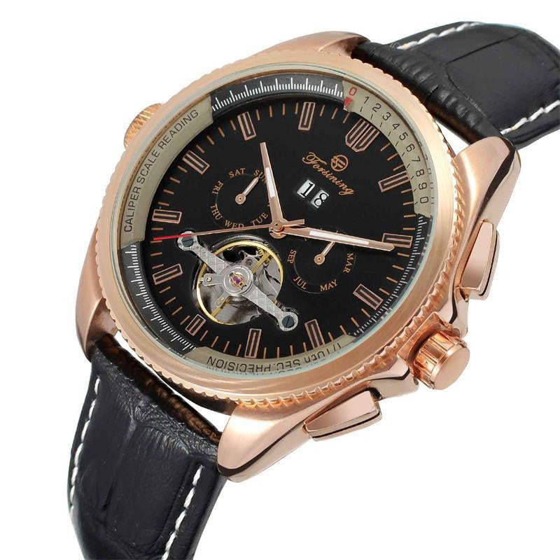 Luxury watch with black dial, rose gold case, and black leather strap on a white background