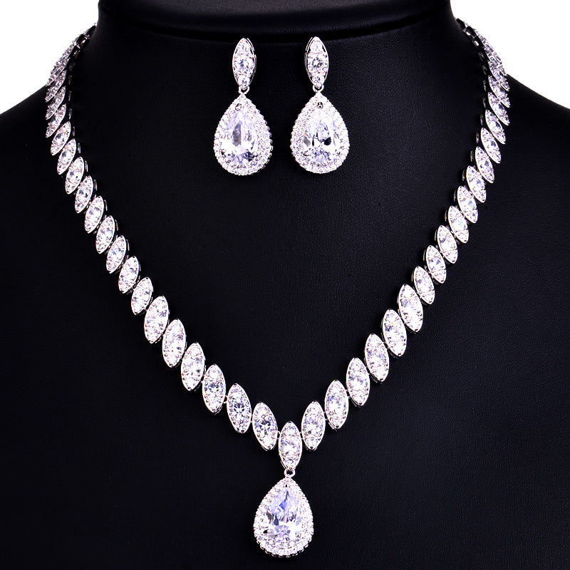 Jewelry set with necklace and earrings on a black background