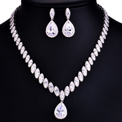 Jewelry set with necklace and earrings on a black background