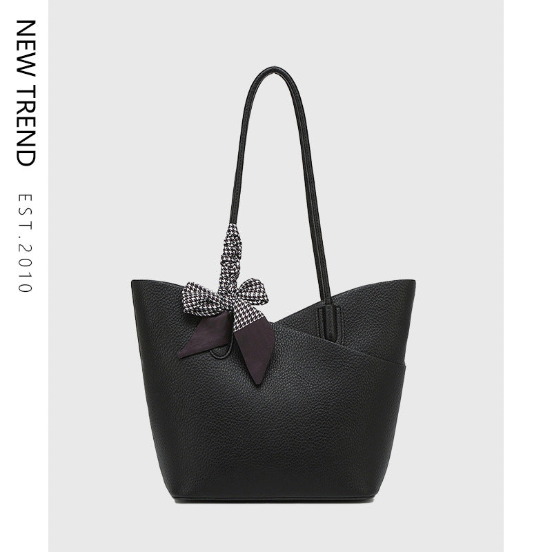 Black textured tote shoulder handbag with rhinestone bow charm