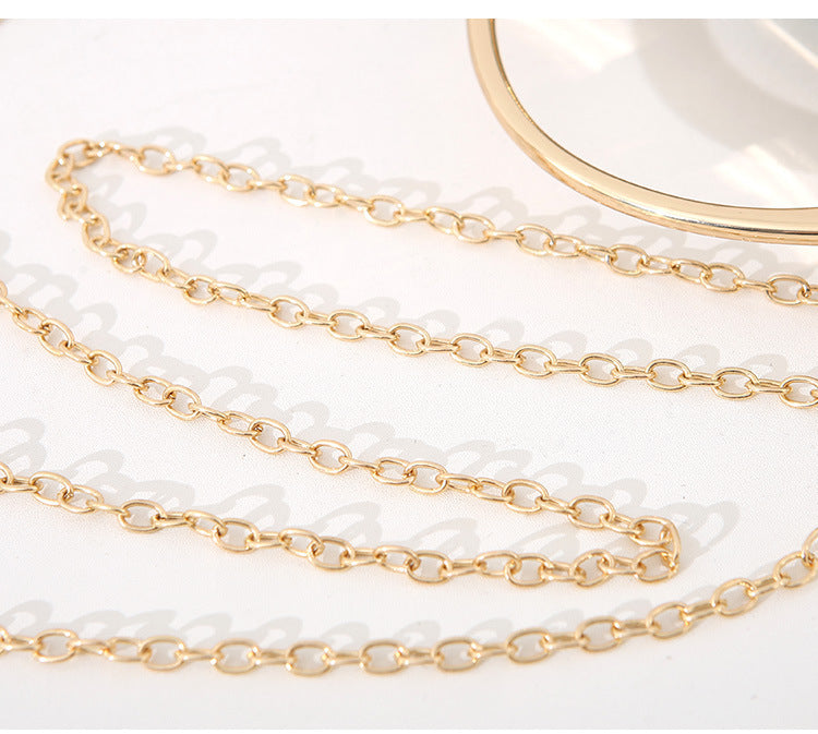 Gold-tone chain strap with interlocking links for diamond clutch