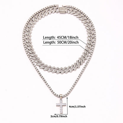 Silver necklace with cross pendant and measurement details on a white background
