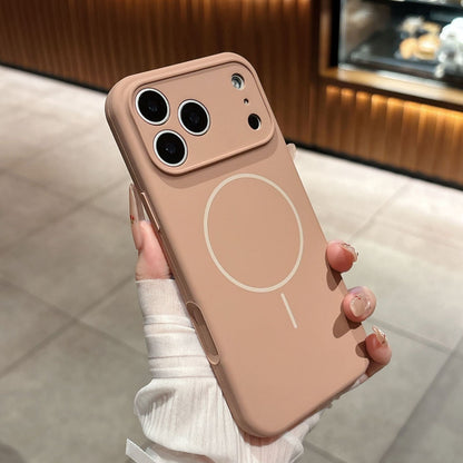 Phone case with a circular design held by a person wearing a white sleeve.