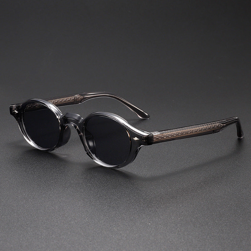 Men’s small round sunglasses with clear-to-black frame and dark lenses