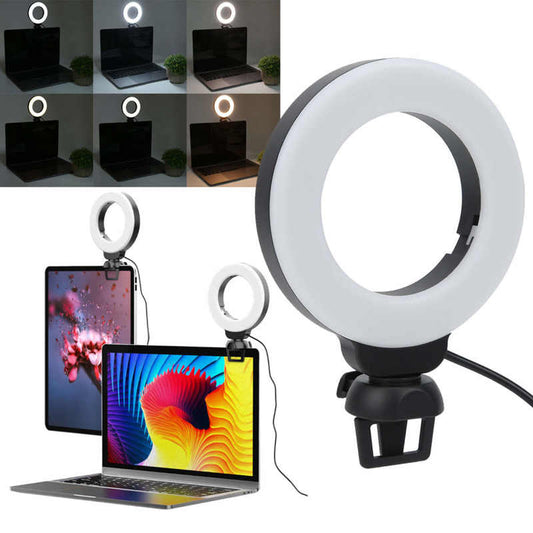 Round LED selfie light with ring panel on a clamp tripod stand, white glow ring