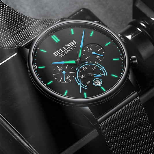 Black watch with green and blue accents on a dark background