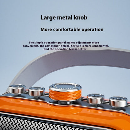 Orange karaoke speaker top panel with large metal knobs and speaker grille