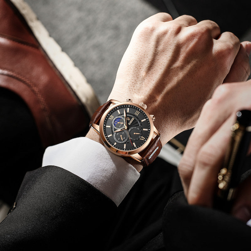 Rose gold chronograph quartz watch on wrist with brown leather strap