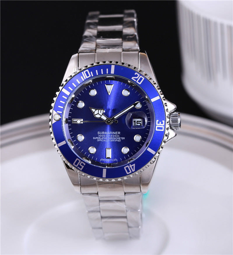 Steel wristwatch with blue dial, stainless bracelet, blue bezel with minute markers.