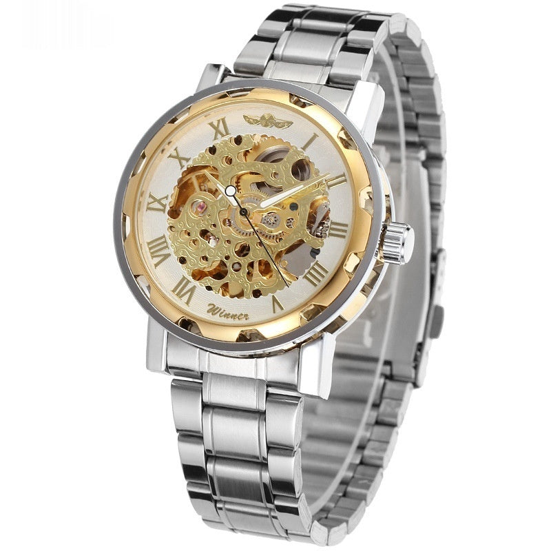 Mechanical skeleton watch with gold dial and exposed gears, silver metal bracelet