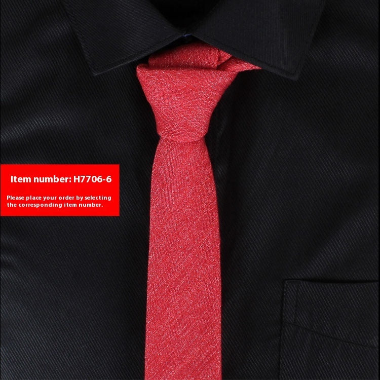 Narrow cotton tie in bright red textured fabric, slim knot.