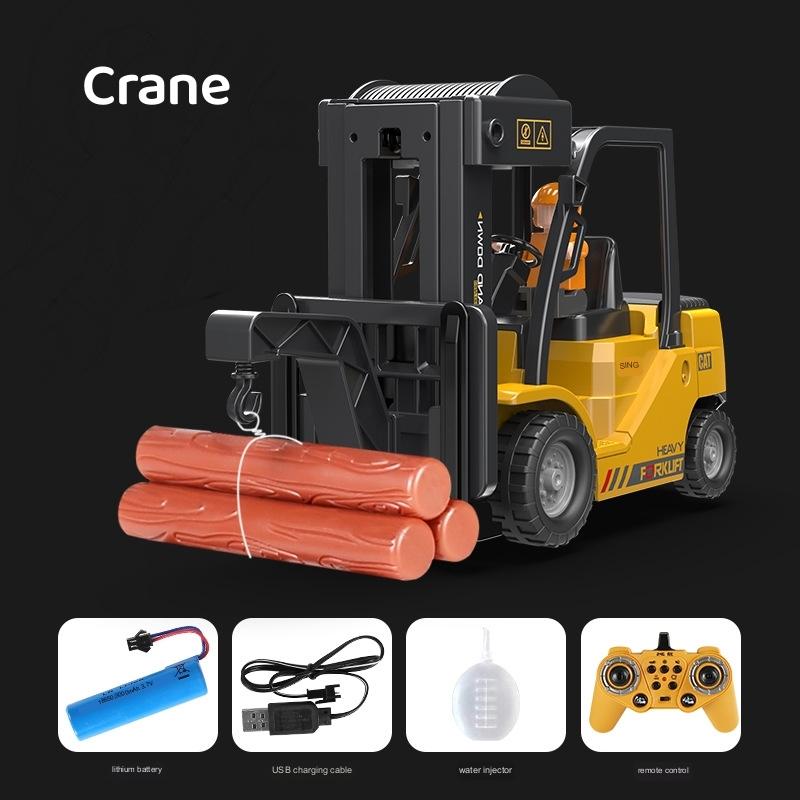 Yellow RC forklift crane toy with black cabin, remote control, and accessories