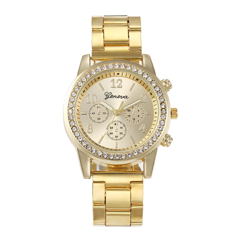 Gold wristwatch with gemstone accents on a white background