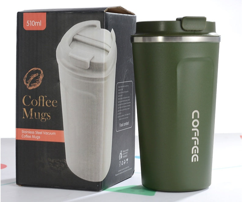Green coffee mug with 'COFFEE' text next to its packaging on a white background