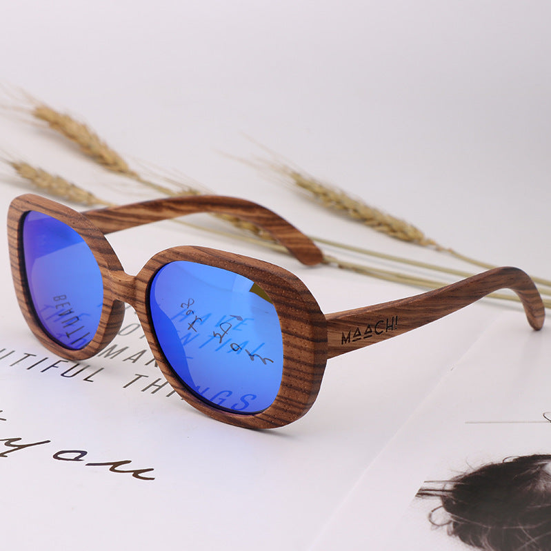 Brown wood-framed sunglasses with blue tinted oval lenses and curved arms