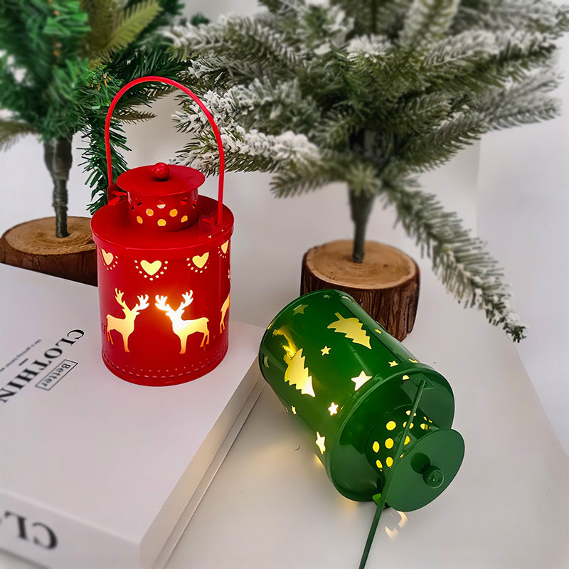Green and red LED lantern candles with cutout trees and reindeer, arched handles