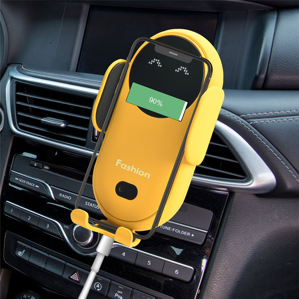 Yellow car phone holder on air vent with 90% charging indicator on screen