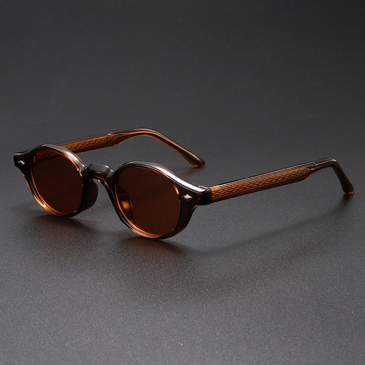 Brown sunglasses with wooden accents on a dark gray background