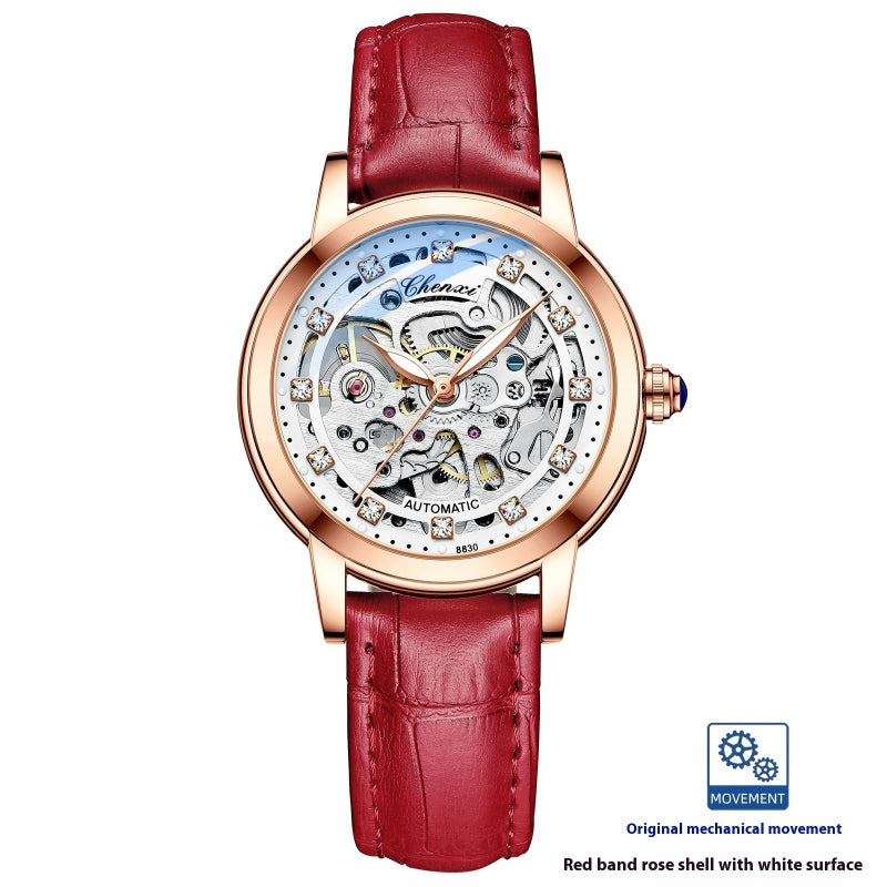 Rose gold skeleton mechanical watch with red leather strap and open dial