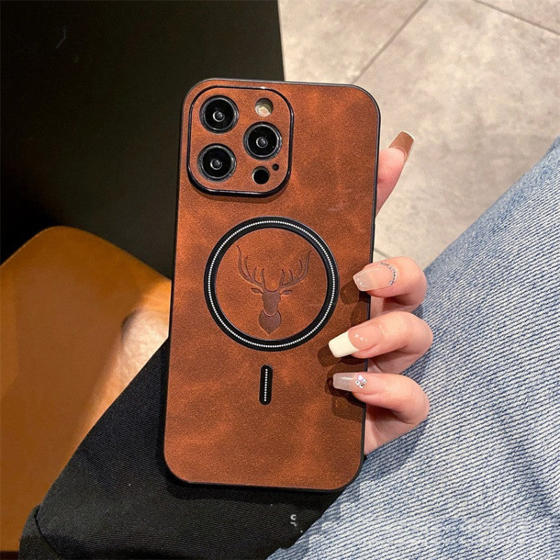 Brown phone case with deer emblem held by a person