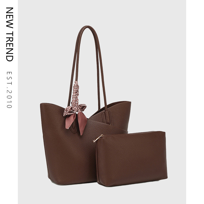 Brown shoulder tote handbag with matching zip pouch and bow charm