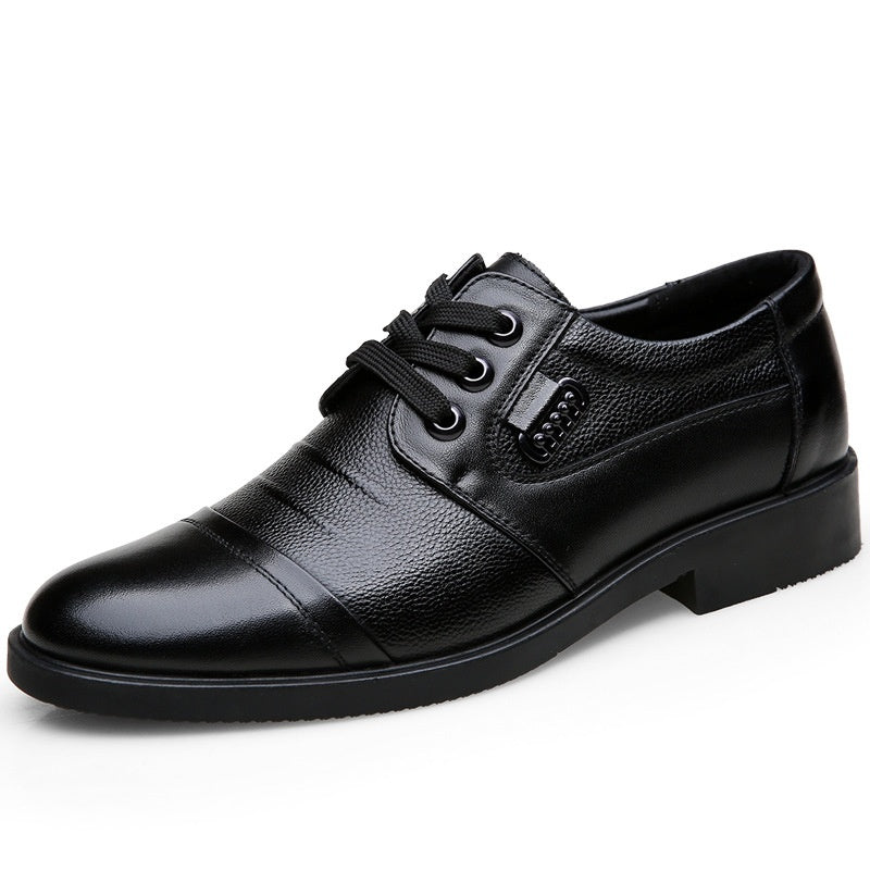 Black leather dress shoe on a white background
