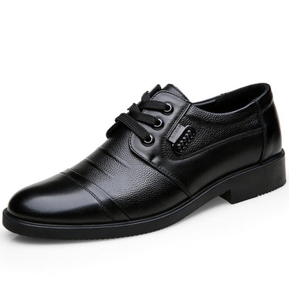 Black leather dress shoe on a white background