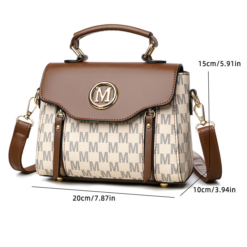 Brown and beige monogram handbag with flap top, gold M emblem, side pockets and strap